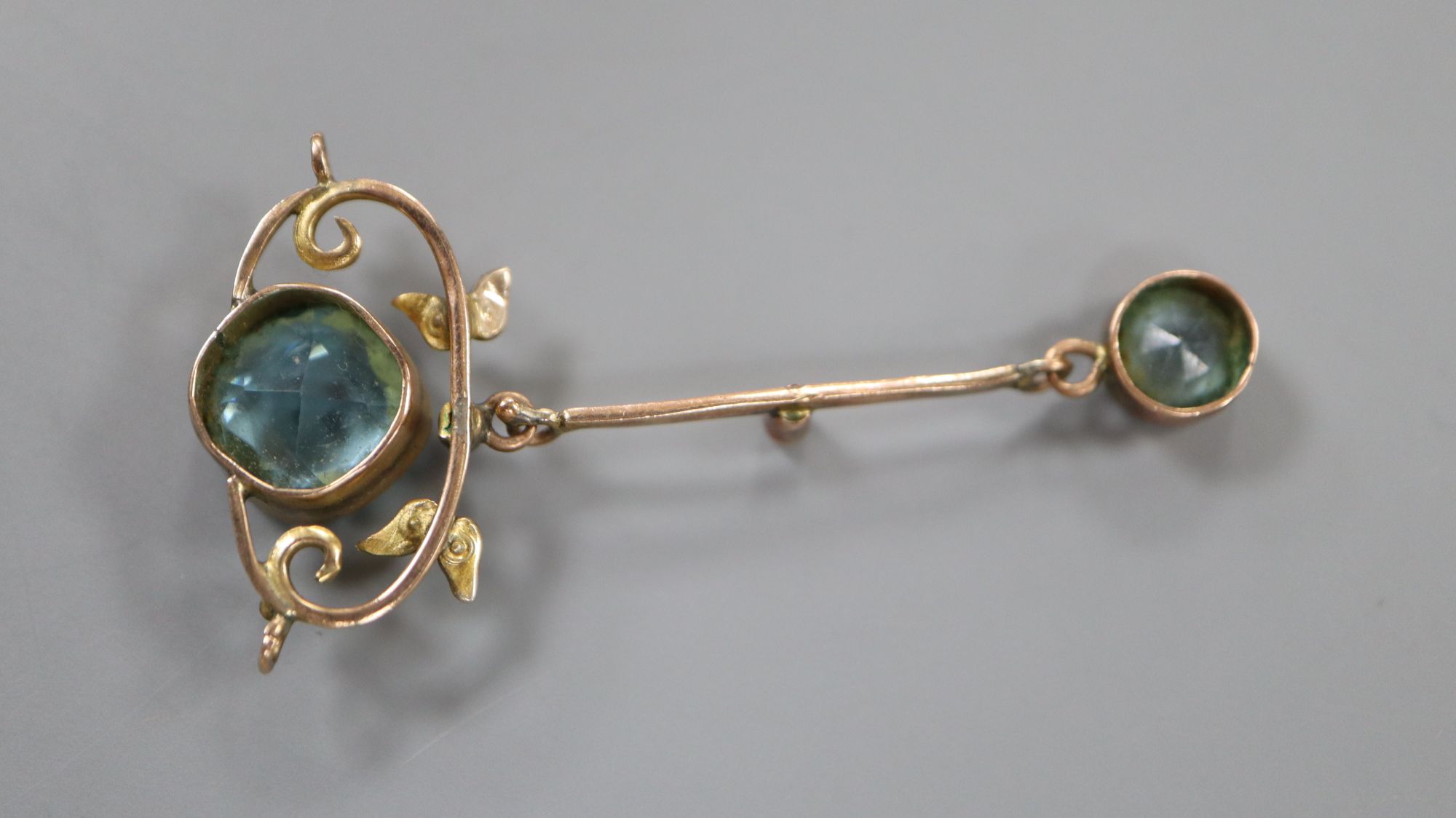 An early 20th century yellow metal, seed pearl and two stone blue topaz set drop pendant, 45mm, gross 2.4 grams.
